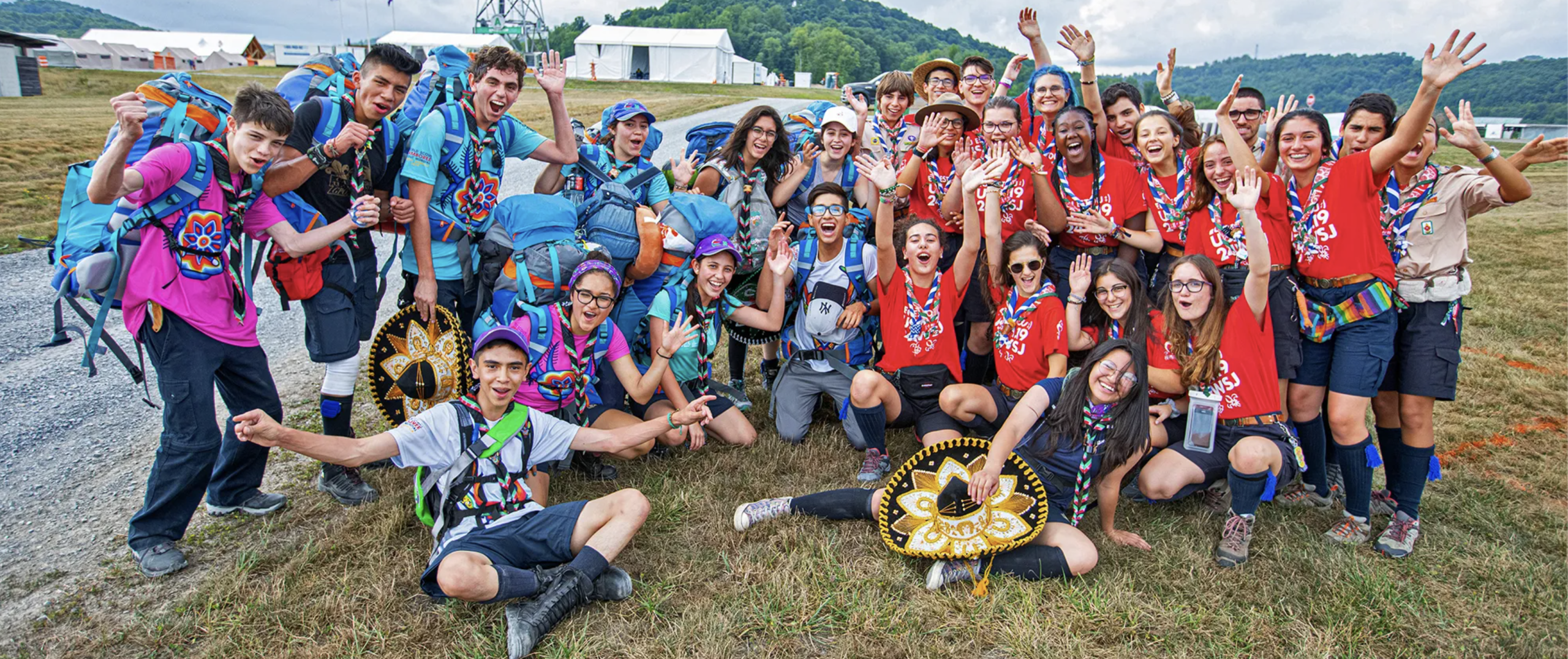 2019 World Scout Jamboree Scouts from different countries celebrate together after arriving at the 2019 World Scout Jamboree. Photograph by Chuck Eaton.